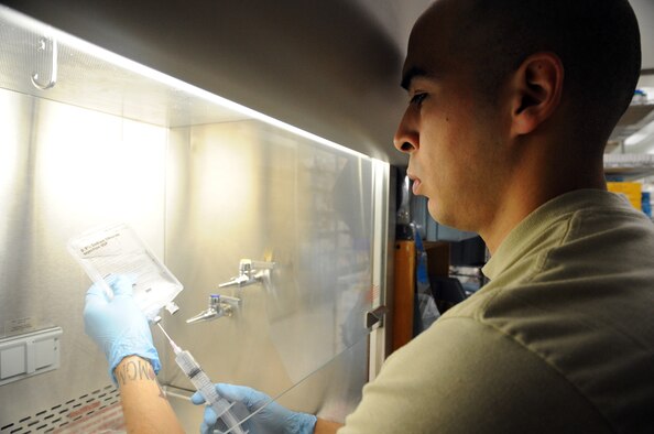Staff Sgt. Luis Alvarado, 455th Expeditionary Medical Support Squadron pharmacy technician, prepares IV medication bags at the Craig Joint Theater Hospital on Bagram Airfield, Afghanistan, April 24, 2013. The pharmacy is the busiest in the Afghanistan area of operations and fills more than 8,000 orders each month. (U.S. Air Force photo/Staff Sgt. David Dobrydney)