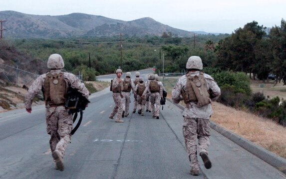 MARINE CORPS BASE CAMP PENDLETON, Calif. –Marine combat cameramen serving with Headquarters and Service Company, Headquarters Battalion, 1st Marine Division, conduct combat conditioning training with full personal protective equipment and combat gear at Camp Margarita here, July 26, 2012. The Marine Corps requires Marines to run a combat fitness test each year. Training in the combat utility uniform helps prepare Marines for the CFT.
(U.S. Marine Corps photo by Sgt. Jacob H. Harrer)