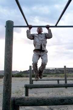 MARINE CORPS BASE CAMP PENDLETON, Calif. – Corporal Daizohn J. Kelly, multimedia reproduction specialist, Headquarters and Service Company, Headquarters Battalion, 1st Marine Division, maneuvers through the obstacle course at Camp Margarita here, July 26, 2013. Marines with HQBn often attach to other units for deployments and must maintain a high level of physical fitness.
(U.S. Marine Corps photo by Sgt. Jacob H. Harrer)