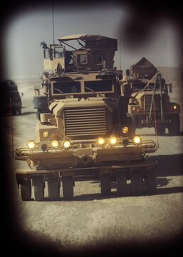 Mine Resistant Ambush Protected vehicles with Combat Logistics Regiment 2, Regional Command (Southwest) cut a path through the desert in Helmand province while delivering needed supplies to several forward operating bases July 25, 2013. The Marines conducted more than 24 hours of continuous logistical operations before returning to their point of origin at Camp Leatherneck.