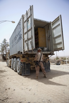 Sgt. Arthur Doers, a native of Iron Mountain, Mich., and Marine Corps Community Services specialist with Combat Logistics Regiment 2, Regional Command (Southwest), opens his truck of goods at Forward Operating Base Kajaki in Helmand province, Afghanistan, Aug. 4, 2013. Doers provided access to various hygiene, uniform and food commodities rarely seen by servicemembers operating in isolated areas. 