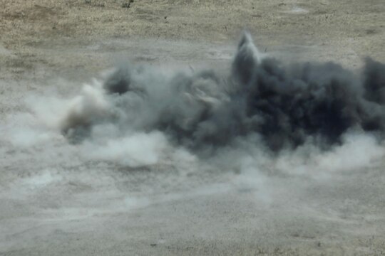 An M67 Fragmentation Grenade explodes propelling burning shrapnel on an impact zone on Range 109 here Aug. 13. Twenty-four Marines with Marine Air Support Squadron 3 of 3rd Marine Aircraft Wing here conducted live-fire grenade training here.


