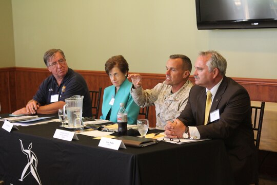 Brig. Gen. Vincent A. Coglianese, center-right, speaks to Mayors, members of the Chambers of Commerce and other members of the local communities during a round table held at the Marine Memorial Golf Course here Aug. 20. "Round tables are a regular feature at the transcript, and they are an opportunity for us to sit down and interview people that are specifically involved in various industries," said Chamberlin, the executive editor for the Daily Transcript. This roundtable was conducted to discuss the economic impact of the base on its surrounding communities. 