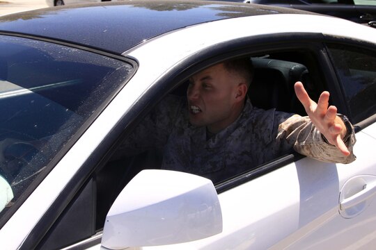 Lance Cpl. Orrin Farmer demonstrates road rage. Road rage is response to what drivers consider poor, inconsiderate or dangeous driving. Photo illustration.