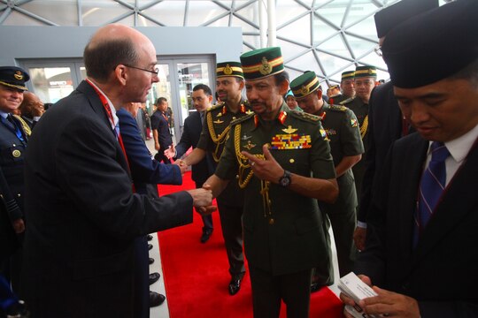 U.S. Ambassador to Brunei Daniel L. Shields greets the Sultan of Brunei Haji Hassanal Bolkiah Mu’izzaddin Waddaulah Dec. 3 at the BRIDEX Exhibition Center in Bandar Seri Begawan, Brunei, during the 4th Biennial Brunei Darussalam International Defense Exhibition and Conference. The five-day event includes displays and demonstrations of military equipment, with the theme of bridging the capability gap. BRIDEX 13 is an opportunity for communication and cooperation with regional partners and allies, builds strong multilateral relationships and enhances preparedness for disasters and other contingency operations. U.S. participation in BRIDEX 13 demonstrates cooperative engagement with Brunei and continued commitment to regional security and stability in the Asia-Pacific region. McGillicuddy is chief of staff, Pacific Air Force.
