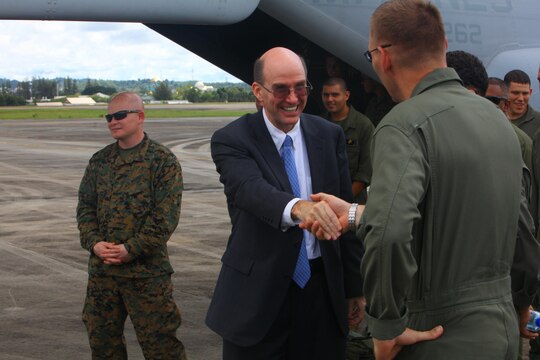 U.S. Ambassador to Brunei Daniel L. Shields, (center) meets Marines with Marine Medium Tiltrotor Squadron 262 Dec. 3 at Rimba Air Base, Brunei during the 4th Biennial Brunei Darussalam International Defense Exhibition and Conference. The five-day event includes displays and demonstrations of military equipment, with the theme of bridging the capability gap. BRIDEX 13 is an opportunity for communication and cooperation with regional partners and allies, builds strong multilateral relationships and enhances preparedness for disasters and other contingency operations. U.S. participation in BRIDEX 13 demonstrates cooperative engagement with Brunei and continued commitment to regional security and stability in the Asia-Pacific region. VMM-262 is with Marine Aircraft Group 36, 1st Marine Aircraft Wing, III Marine Expeditionary Force.