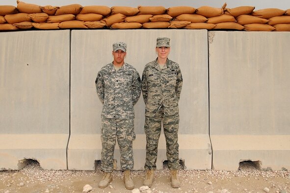 U.S. Air Force Master Sgt. Shanda Moon, executive assistant to the Command Chief, Air Force Central Command, and U.S. Army Spc. Alec Potthoff, 1st Battalion, 43rd Air Defense Artillery, 11th Air Defense Artillery Brigade wheeled vehicle mechanic, pose for a photo while deployed at an undisclosed location in Southwest Asia, here. Moon and her nephew, Potthoff, recently had an unexpected reunion in the dining facility after more than five years without seeing each other due to their separate military obligations. Moon, deployed from Cannon AFB, N.M., and Potthoff, deployed from Fort Bliss, Texas are both natives of Durango, Colo. (U.S. Air Force photo/Staff Sgt. Benjamin Mota)
