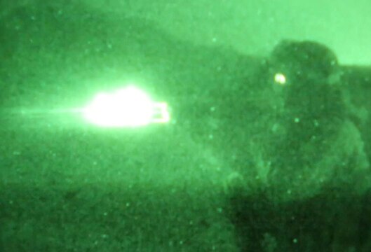 Lance Cpl. Tyler Smith, scout, Delta Company, 1st Light Armored Reconnaissance Battalion, a native of Oklahoma City, fires his rifle at unknown distance targets at night during a weeklong field exercise here Nov. 18 through 24, 2013. The scouts have a hard time with night shoots because the targets become hard to pick out. Lance Cpl. Eric Bernes, an LAV crewman with Delta Co., said they have to adapt and overcome to accomplish the mission.