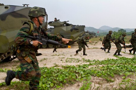 Royal Thai Marines move up the beach during an amphibious assault rehearsal for exercise Cobra Gold 2013 here, Feb. 13. The amphibious assault combined the capabilities of Company A, Battalion Landing Team 1st Battalion, 5th Marine Regiment, 31st Marine Expeditionary Unit, and Royal Thai Marines in a bilateral attack. Exercise Cobra Gold is an annual event that includes numerous multilateral exercises ranging from amphibious assaults to non-combatant evacuations. The training aims to improve interoperability between the United States, Kingdom of Thailand, and many other participating countries. The 31st MEU is the only continuously forward-deployed MEU and is the Marine Corps’ force in readiness in the Asia-Pacific region.