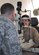 Optometrist Capt. Mike Gitchel inspects the retina of pilot Maj. Amy Lou Emanuel, 340th Expeditionary Refueling Squadron, January 6, 2013. The 379th Expeditionary Aeromedical-Dental Flight optometry element is a full-service clinic available to U.S. and coalition service members, government civilians and base contractors supporting operations in Southwest Asia. (U.S. Air Force photo/Master Sgt. Christian Michael)