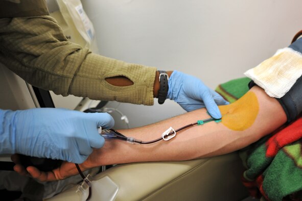 U.S. Army Sgt. Tahera Parker, 432nd Blood Support Detachment laboratory technician, draws blood platelets from Spc. Paul Bizzoco, 582nd Medical Logistics Company, at the Craig Joint Theater Hospital on Bagram Airfield, Afghanistan, Jan. 24, 2013.  The 432nd BSD is responsible for supplying blood products throughout Afghanistan.  (U.S. Air Force photo/Senior Airman Chris Willis)