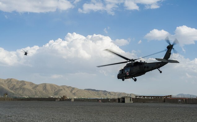 Tactical Evacuation Critical Care Team members of 3rd Platoon, C Company, 2-149 General Support Aviation Battalion Medical Evacuation transfer a patient, injured by an improvised-explosive device, to another medical facility via a UH-60 Black Hawk helicopter,  Forward Operating Base Orgun East, Paktika province, Afghanistan, May 13, 2013. MEDEVAC teams specialize in moving and treating U.S. and coalition forces who are injured and risk dying without immediate emergency care. (U.S. Air Force photo/Staff Sgt. Marleah Miller)