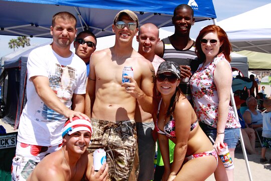 A group of friends enjoy sand, surf and music at Del Mar Beach here during the Fourth of July Beach Bash. The daylong event featured live entertainment, free give-aways, a military tribute video and concluded with fireworks.

