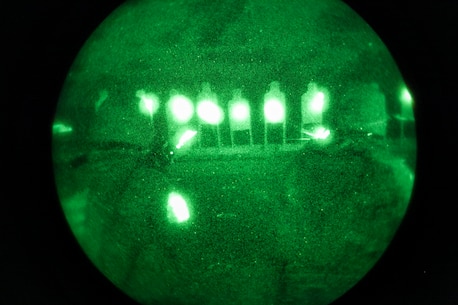Marines with Company E., Battalion Landing Team 2nd Battalion, 4th Marines, 31st Marine Expeditionary Unit, take aim on silhouette targets using rail-mounted laser sights during close quarters, low-light combat marksmanship training from the flight deck here, July 5. More than 100 Marines of the company were able to test their night-time marksmanship on the flight deck, expending thousands of rounds of ammunition over a period of three hours. The 31st MEU is the Marine Corps’ force in readiness for the Asia Pacific region and the only continuously forward-deployed MEU. 