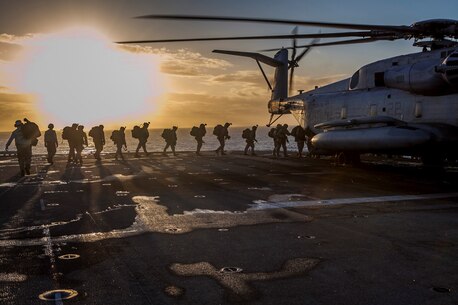 Marines and Sailors with Company E., Battalion Landing Team 2nd Battalion, 4th Marines, 31st Marine Expeditionary Unit, board a CH-53E Super Stallion helicopter from Marine Medium Tiltrotor Squadron 265 (Reinforced), 31st MEU, for a raid rehearsal as a part of Talisman Saber 2013, here, July 17. Talisman Saber 2013 is a biennial training activity aimed at improving Australian Defense Force and U.S. combat readiness and interoperability as a Combined Joint Task Force. The 31st MEU is the Marine Corps' force in readiness in the Asia-Pacific region and the only continuously deployed MEU. (Marine Corps photo by Cpl Codey Underwood)