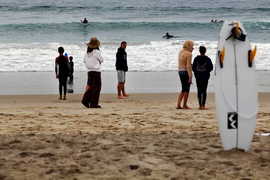 Parents watch as their children surf during the Hurley surf event held at Del Mar beach here June 2. Hurley’s summer surf tour travels around the country to let young kids learn from and ride with professional surfers.