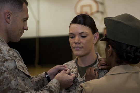 Cpl. Devin Smith, legal chief at Marine Barracks Washington, D.C., gets promoted to the rank of corporal in the U.S. Marine Corps, June 3. (Official Marine Corps photo by Lance Cpl. Dan Hosack)