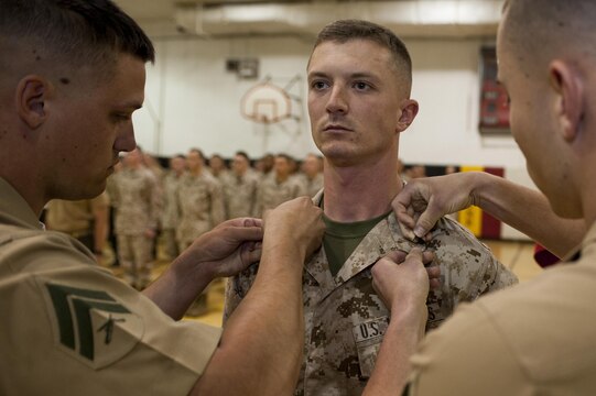 Cpl. Sean Breheny, rifle inspector with the Marine Corps Silent Drill Platoon, gets promoted to the rank of corporal during a ceremony at Marine Barracks Washington, D.C., June 4.