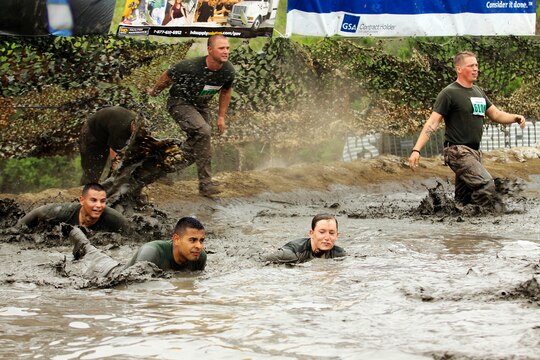 More than 600 Marines and sailors ran the 20th annual World Famous Mud Run as a part of the Commanding General’s Cup here June 7.
The service members entered in teams of five or individually and trudged through 6.2 miles of dirt, mud and off-road obstacles.
