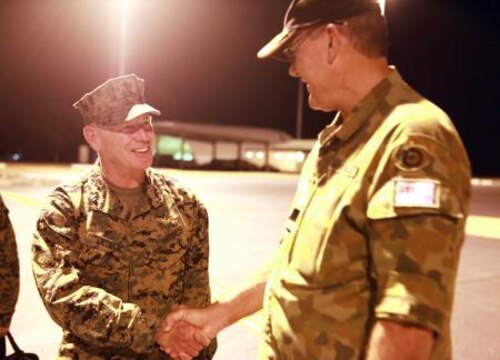 Lt. Gen. Kenneth Glueck, Jr. (left), commanding general, III Marine Expeditionary Force, shakes hands with Air Commodore Ken Watson (right), commander, Northern Command, Royal Australian Air Force, after landing here, May 27. Glueck flew to Australia to visit MRF-D Marines and tour surrounding military facilities.