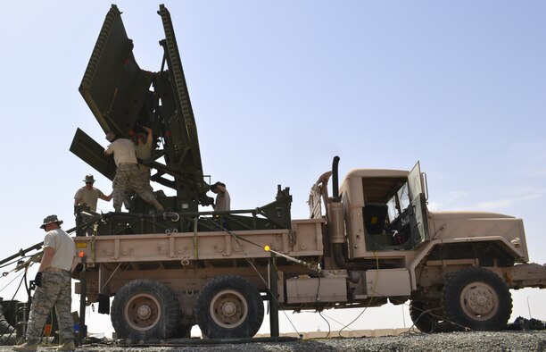 Members of the 727th Expeditionary Air Control Squadron fold and dismount an AN/TPS 75 radar at an undisclosed location in Southwest Asia May 29, 2013, in preparation for relocating the antennae to its new home atop a newly constructed 55 foot tower. The goal of the project was to protect the AN/TPS 75 radar from the harsh wind and heat of the region. The 727th EACS consists of the 255th Air Control Squadron from Gulfport, Miss., with augmentation from eight Air National Guard units and an Air Defense Artillery Fire Control Officer/Assistant team from 69thAir Defense Artillery Brigade, Fort Hood, Texas.  The 255th ACS has deployed four times in support of contingency operations overseas in the past ten years. (U.S. Air Force photo by Master Sgt. Seaton Hixson)