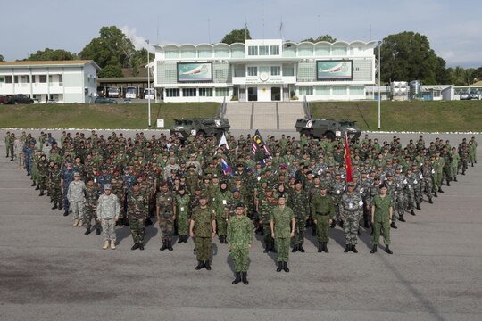 Representatives from various Asia-Pacific nations gather for a multinational group photo during the Association of Southeast Nations Defence Ministers Meeting-Plus ASEAN Humanitarian Assistance/Disaster Relief and Military Medicine Exercise hosted by Brunei Darussalam June 12 at Berakas, Brunei. More than 1,800 multinational personnel from 18 Asia-Pacific nations are participating in the ASEAN exercise, which provides a platform for regional partner nations to address shared security challenges, strengthen defense cooperation, enhance interoperability and promote stability in the region. ASEAN is comprised of Brunei, Cambodia, Indonesia, Laos, Malaysia, Myanmar (Burma), Philippines, Singapore, Thailand and Vietnam. Non-ASEAN countries include Australia, China, India, Japan, New Zealand, Republic of Korea, Russia and the U.S. The exercise is scheduled from June 16 to 20. (U.S. Marine Corps photo by Lance Cpl. Allison Bak/Released)