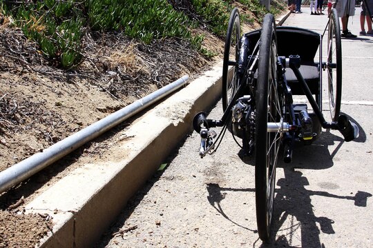 A hand peddled bicycle sits along a curb in a parking lot before the Race Across America held at the Oceanside Pier in Oceanside, Calif. June 15. The bike belongs to a competitor with the Walter Reed Bethesda team, which is made up of wounded Army and Marine Corps veterans that will compete in the 3,000-mile race from Oceanside, Calif. to Annapolis, Md. 