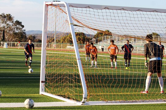 Marine Sgt. Feliple Magallon approaches the ball for a penalty kick during the first half of their game against Bethesda University held at the 11-area field here June 24.  Magallon scored his first of two goals with the penalty kick and is the only Marine from Camp Pendleton on Team USA Armed Forces. Team USA Armed Forces is scheduled to play in the 1st Annual Military World Cup held in Baku, Azerbaijan.
