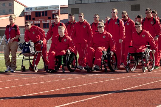 Athletes from Wounded Warrior Battalion East march out onto the field before the singing of The Star-Spangled Banner during the opening ceremony of the Marine Corps Trials here Feb. 28.

Wounded and ill Marines will be competing in the 2013 Marine Corps Trials here March 1-6. 
