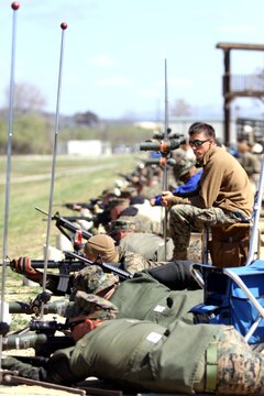 Marines fire their match rifles from the prone firing position while their teammates record the shot points on targets down-range during the Western Division Matches held at Wilcox Range here March 6.
