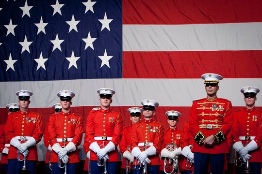 The U.S. Marine Drum & Bugle Corps and Maj. Brian J. Dix, the D&B director, stand on stage after a performance during the Semper Fidelis Society of Boston's 237th Marine Corps Birthday celebration at the Boston Convention and Exhibition Center Nov.9. 