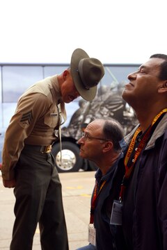 Sgt. Mark Reconsal corrects Mike Archer during a visit from the Marine Corps Executive Forum at the Marine Corps Recruit Depot San Diego March 7. Reconsal, a drill instructor with Support Battalion, Receiving Company, MCRD San Diego and Archer is the Museum of Flight Construction Coordinator in Seattle, Wash. and a member Marine Corps Executive Forum. 