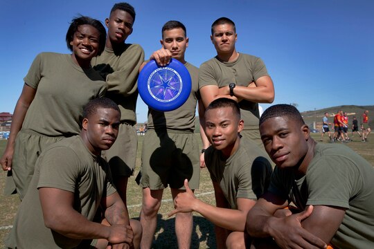 The “Dream Team” from Combat Logistics Regiment 1, gathers for a group photograph after a game during an ultimate Frisbee tournament at the Camp Horno Football Field here March 13.