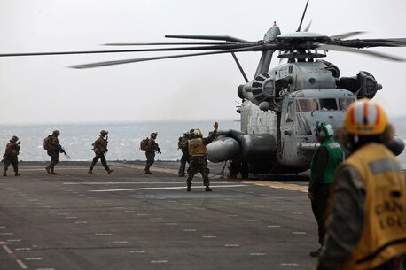 Members of the 31st Marine Expeditionary Unit’s Tactical Recovery of Aircraft and Personnel team board a CH-53E Super Stallion helicopter here, March 14. The 31st MEU is currently deployed with PHIBRON 11, conducting their semi-annual Certification Exercise. CERTEX is designed to test the MEU’s wide range of capabilities, ensuring their readiness for any contingency that may occur in the region. The 31st MEU is the Marine Corps’ force in readiness for the Asia-Pacific region and the only continuously forward-deployed MEU.