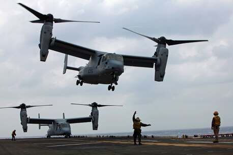 An aviation boatswain’s mate (handling) with Amphibious Squadron 11 guides an MV-22 Osprey helicopter from Marine Medium Tiltrotor Squadron 265 on to the flight deck here, March 14. As one of the rotating squadrons of the 31st Marine Expeditionary Unit, VMM-265 must maintain proficiency in landing on the deck of a moving ship. The 31st MEU is currently deployed with Amphibious Squadron 11, conducting their semi-annual Certification Exercise. CERTEX is designed to test the MEU’s wide range of capabilities, ensuring their readiness for any contingency that may occur in the region. The 31st MEU is the Marine Corps’ force in readiness for the Asia-Pacific region and the only continuously forward-deployed MEU.