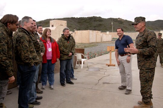 Brig. Gen. Vincent A. Coglianese speaks to participants of the West Coast Marine Corps Executive Forum at the Infantry Immersion Trainer on Marine Corps Base Camp Pendleton March 7. Coglianese is the base commanding general and regional authority for five military installations in the Southwestern United States. Robert Thielen, the site manager for the training center here, provided a tour of the facility. 
