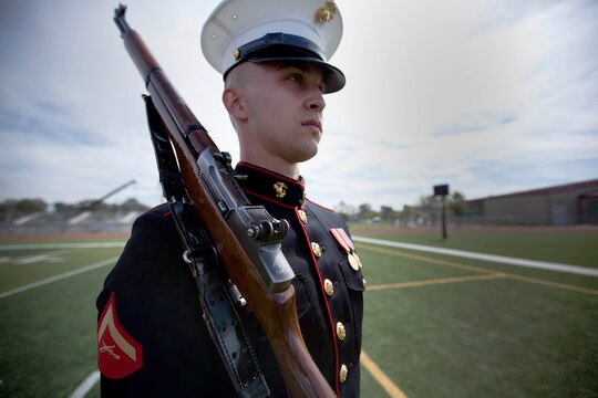 Lance Cpl. Garrett A. Troutner is a rifleman, assigned to the Marine Corps' Silent Drill Platoon, who performed in the 2013 Battle Color Ceremony held on the Paige Filedhouse Football Field here March 15. In addition to the countless hours these Marines spending perfecting their drill sequence, they also make time to maintain their Marine rifleman skills with field training exercises. 