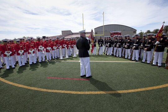 Lt. Gen. John A. Toolan, center, thanks the Marines from the Battle Color Detachment for their performance after the Battle Color Ceremony at the Paige Fieldhouse Football Field here March 15. Toolan is the commanding general for the 1st Marine Expeditionary Force here.