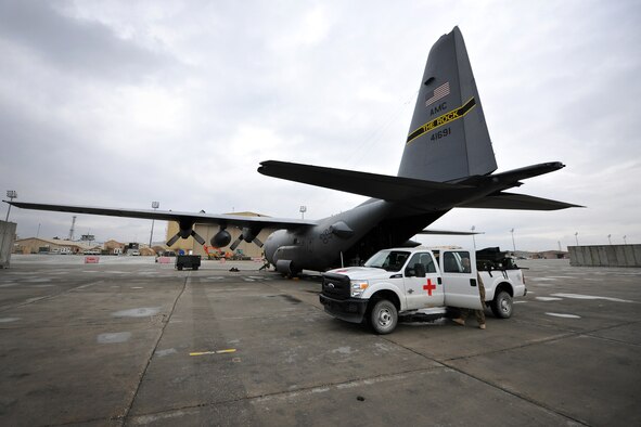 Members of the Contingency Aeromedical Staging Facility and 455th Expeditionary Aeromedical Evacuation Squadron assist patients on a C-130 Hercules on Bagram Airfield, Afghanistan, Feb. 2 1, 2013. The CASF is the relay between the Craig Joint Theater Hospital and aeromedical evacuation missions.  (U.S. Air Force photo/Senior Airman Chris Willis)