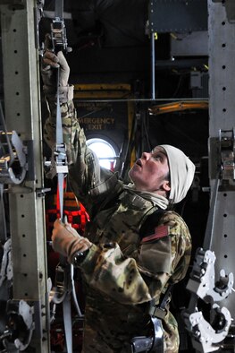 Master Sgt.  Jennifer Higgs, 455th Expeditionary Aeromedical Evacuation Squadron technician, conducts an equipment function check inside a C-130 Hercules on Bagram Airfield, Afghanistan, Feb. 21, 2013.  The 455th EAES perform their missions on fixed wing aircraft, including the C-17 Globemaster III, C-130 Hercules and KC-135 Stratotanker, and can provide extensive critical care capability with the Critical Care Air Transport Teams. (U.S. Air Force photo/Senior Airman Chris Willis)
