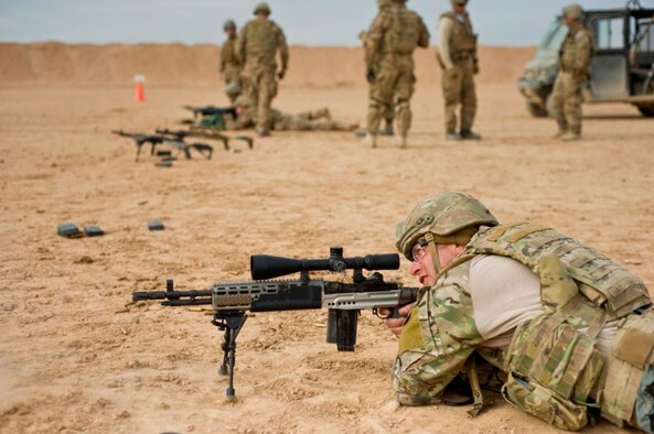 Tech. Sgt. Dustin Lambries, a 466th Operating Location Delta Explosives Ordinance Disposal team lead, fires an Mk 14 enhanced battle rifle at a firing range at Camp Leatherneck, Afghanistan, Dec. 28, 2012. After identifying the need for a more capable rifle while outside the wire, Delta upgraded its dismount teams with the EBR, enhancing their ability to respond to long-distance hostile fire. (U.S. Air Force photo/Tech. Sgt. Swift Moon)