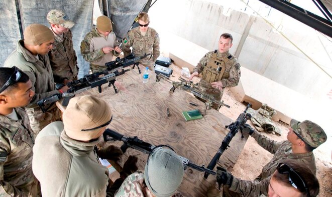 Staff Sgt. David Deel, a Combat Arms Training and Maintenance instructor with the 46th Expeditionary Rescue Squadron, trains 466th Operating Location Delta Explosives Ordinance Disposal Airmen on the Mk 14 enhanced battle rifle at Camp Leatherneck, Afghanistan, Dec. 28, 2012. After identifying the need for a more capable rifle while outside the wire, Delta upgraded its dismount teams with the EBR, enhancing their ability to respond to long-distance hostile fire. (U.S. Air Force photo/Tech. Sgt. Swift Moon)