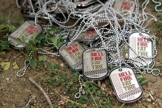 Military and civilian mountain bikers received souvenir dog tags for participating for competing in the first Hell Fire Fat Tire Bike Race here March 23. The bikers raced through 13 and 23-mile courses and traveled over terrain ranging from sea-level to 600 feet in elevation.