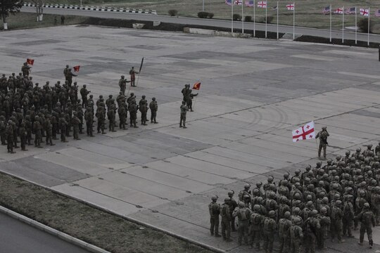 Marines and sailors with Black Sea Rotational Force 13 and the Republic of Georgia Army's 23rd Infantry Battalion rehearse for the opening ceremony for Agile Spirit 13 March 18, 2013, aboard Vaziani Airfield. Exercise Agile Spirit 13 aims to enhance our professional military capacity and increase our interoperability.