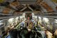 Members of the of the 455th Expeditionary Aeromedical Evacuation Squadron assist patients on a C-17 Globemaster III medical transport flight out of Bagram Airfield, Afghanistan, March 21, 2013. With help from the Critical Care Air Transport Team, the crew can turn a regular medical transport aircraft into a flying intensive care unit, making it possible to move severely injured or gravely ill servicemembers by air. (U.S. Air Force photo/Senior Airman Chris Willis)