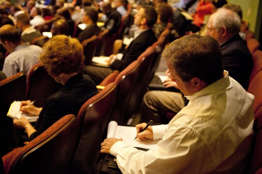 Small-business owners listen to presentations and take notes during the Small Business Outreach event hosted by Marine Corps Base Installations East and Naval Facilities Engineering Command at Coastal Carolina Community College March 19. The outreach event included question and answer sessions, remarks from local installations leaders and Naval Facilities Engineering Command, panels about new legislation, resources on the federal market, legal concerns, and trends in federal contracting.