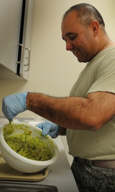 Master Sgt. John P. Garcia Jr, Air Forces Central Command vehicle fleet manager, and native of Los Angeles, Calif., makes guacamole May 3 at an undisclosed location in Southwest Asia. (U.S. Air Force photo by Staff Sgt. Rachelle Elsea) 

