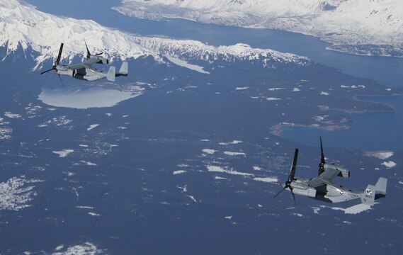 Two MV22B Ospreys with Marine Medium Tiltrotor Squadron 161 fly over Alaskan mountains on thier flight to Anchorage, Alaska.  The Ospreys flew out to meet and support the USS Anchorage during public tours and the ship's commissioning ceremony May 4.  VMM-161 is the first squadron of Ospreys to make the trip to Alaska.
