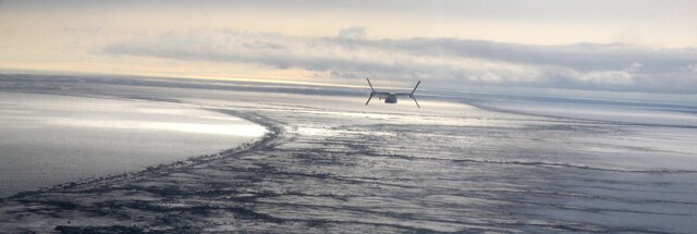 An MV-22B Osprey from VMM-161 flys over frozen Alaskan lands en route to the USS Anchorage April 30.  VMM-161 is in Alaska to support the the USS Anchorage and be a static display during public tours before the ship's commissioning ceremony on May 4. 