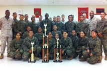 GySgt Jaime Hernandez, second from right stands with Marine Corps Activity Guam and Marine Corps Junior Reserve Officer Training Corps during his reenlistment ceremony at the Okkado High School, 13 May, 2013.